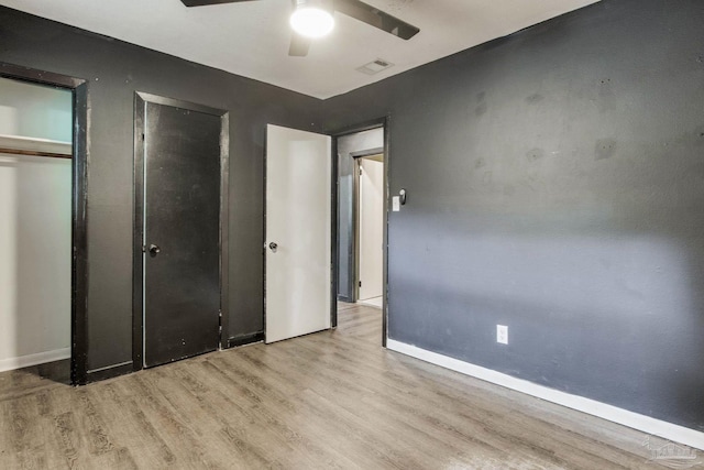 unfurnished bedroom featuring light hardwood / wood-style flooring and ceiling fan