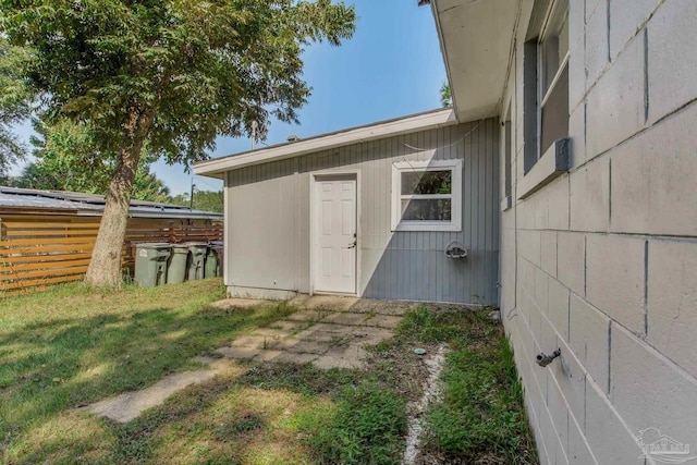 view of outbuilding with a yard