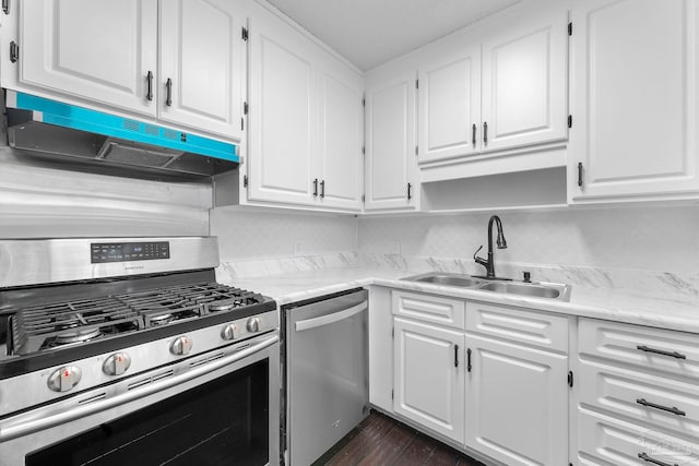 kitchen featuring sink, stainless steel appliances, dark hardwood / wood-style flooring, and white cabinets