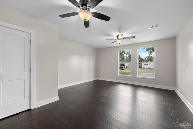 unfurnished room featuring ceiling fan and dark hardwood / wood-style floors