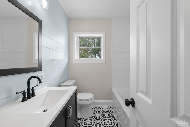 bathroom featuring tile patterned flooring, vanity, and toilet