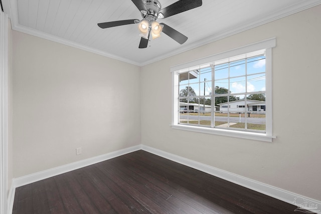 empty room with a wealth of natural light, ornamental molding, and dark hardwood / wood-style flooring