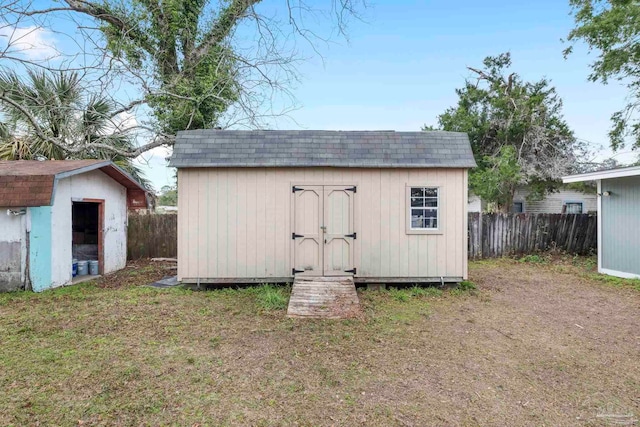 view of outbuilding featuring a yard