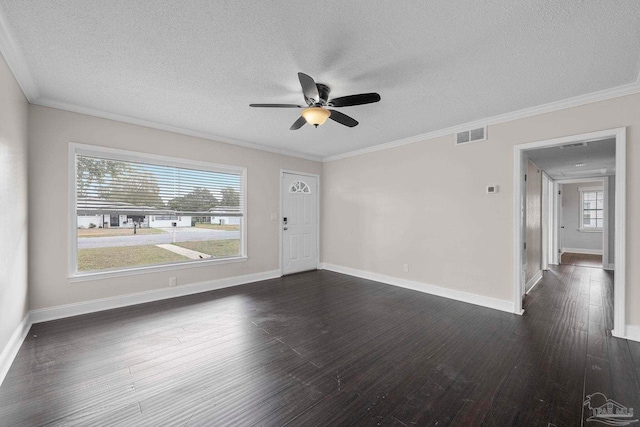 spare room featuring dark hardwood / wood-style flooring, a textured ceiling, ceiling fan, and crown molding