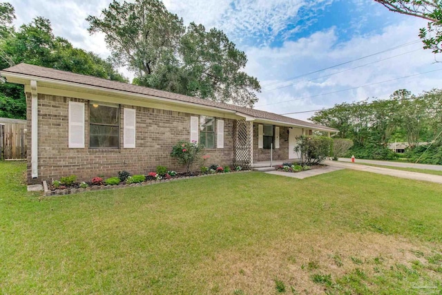 8500 Blue Jay Way, Pensacola, FL 32534 - ranch-style house with brick siding and a front yard