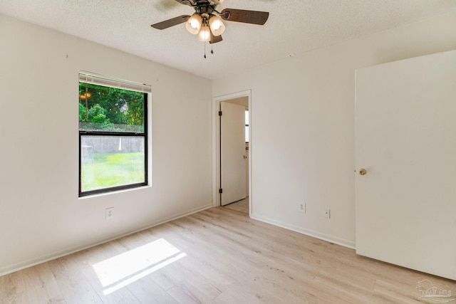 8500 Blue Jay Way, Pensacola, FL 32534 - empty room featuring light wood-style flooring, ceiling fan, a textured ceiling, and baseboards