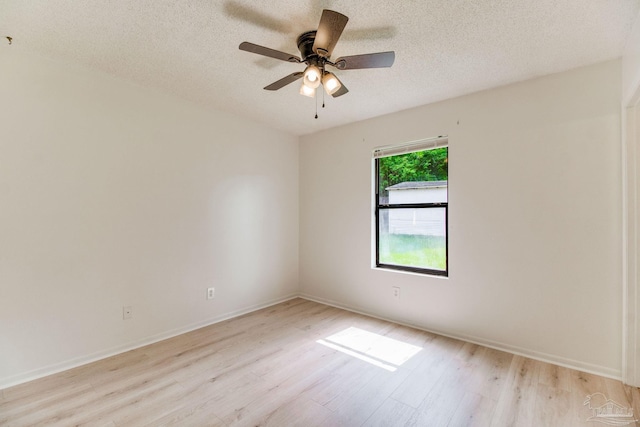 8500 Blue Jay Way, Pensacola, FL 32534 - spare room with light wood finished floors, a textured ceiling, ceiling fan, and baseboards