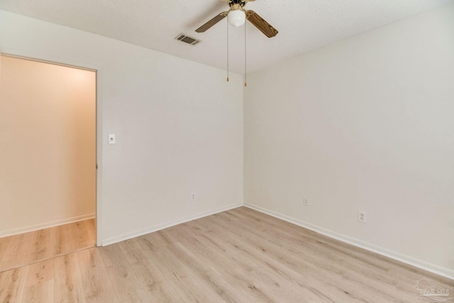 8500 Blue Jay Way, Pensacola, FL 32534 - empty room featuring light wood finished floors, ceiling fan, and baseboards