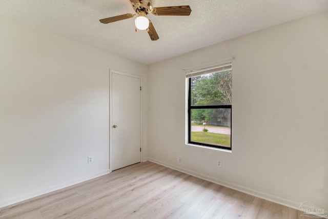 8500 Blue Jay Way, Pensacola, FL 32534 - spare room with light wood-style floors, a textured ceiling, baseboards, and ceiling fan