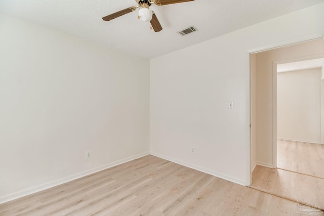 8500 Blue Jay Way, Pensacola, FL 32534 - unfurnished room featuring a ceiling fan, light wood-style flooring, and baseboards