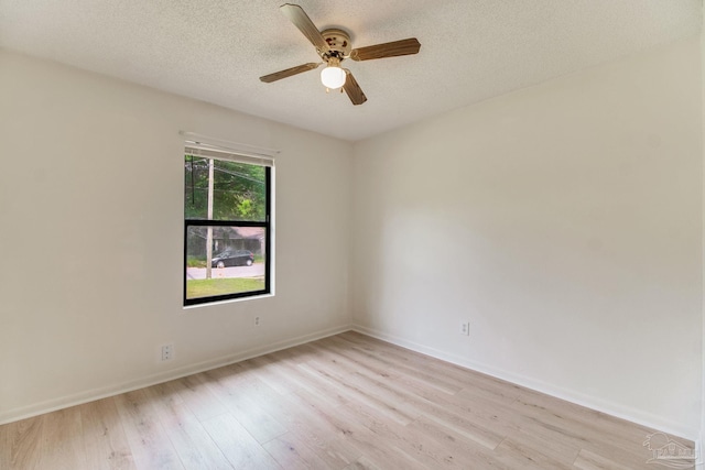 8500 Blue Jay Way, Pensacola, FL 32534 - empty room with light wood finished floors, a ceiling fan, baseboards, and a textured ceiling