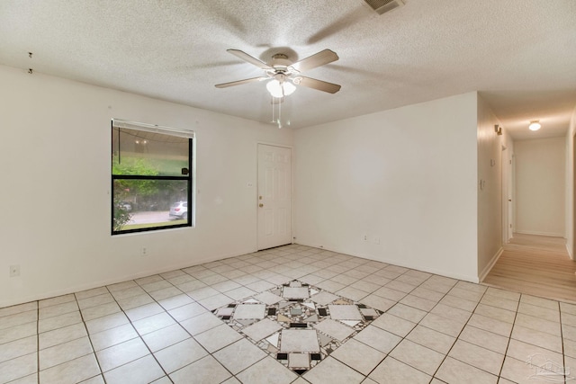 8500 Blue Jay Way, Pensacola, FL 32534 - unfurnished room with a ceiling fan, a textured ceiling, and light tile patterned floors