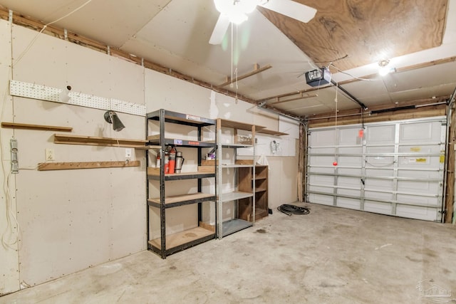 8500 Blue Jay Way, Pensacola, FL 32534 - garage with a garage door opener and a ceiling fan