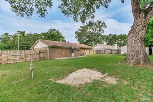 8500 Blue Jay Way, Pensacola, FL 32534 - view of yard featuring a patio and central AC