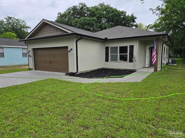 205 Webb St, Cantonment, FL 32533 - ranch-style home with a garage, driveway, a front yard, and central air condition unit