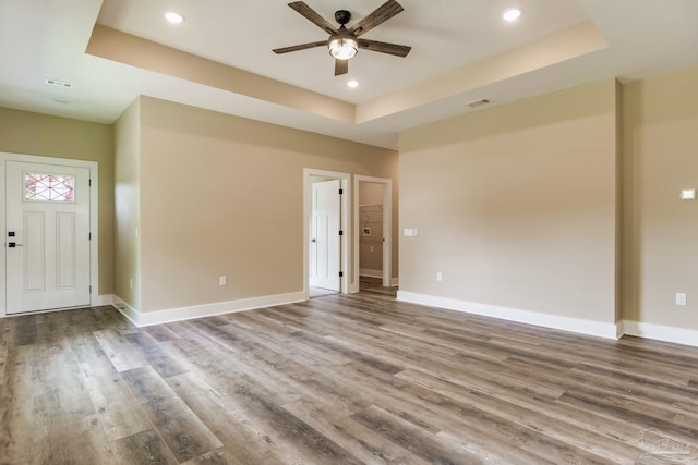 205 Webb St, Cantonment, FL 32533 - unfurnished room with ceiling fan, a raised ceiling, wood finished floors, baseboards, and recessed lighting