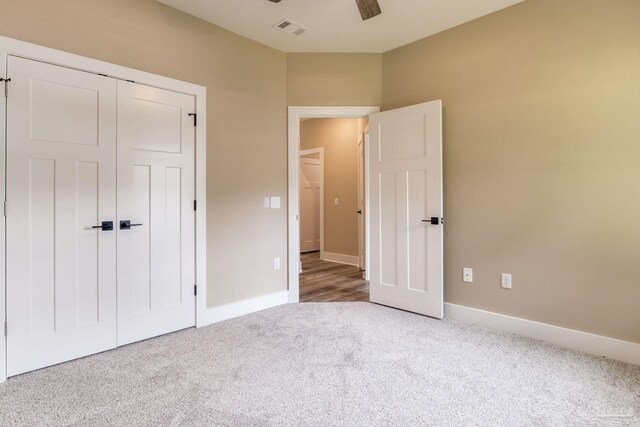 205 Webb St, Cantonment, FL 32533 - unfurnished bedroom featuring carpet, baseboards, a closet, and a ceiling fan