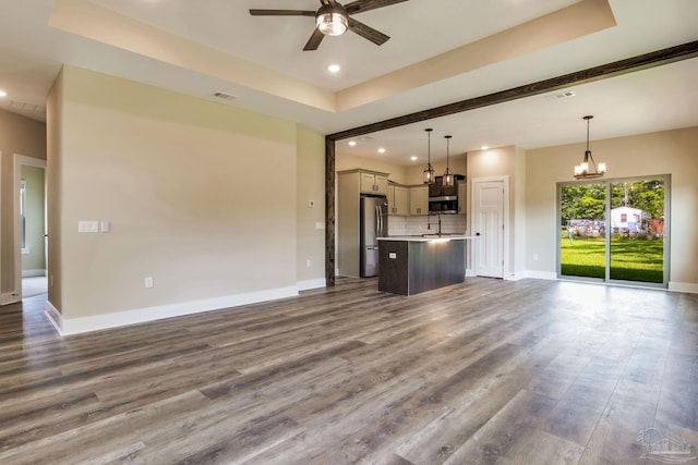 205 Webb St, Cantonment, FL 32533 - unfurnished living room with a ceiling fan, a sink, a chandelier, baseboards, and dark wood-style floors
