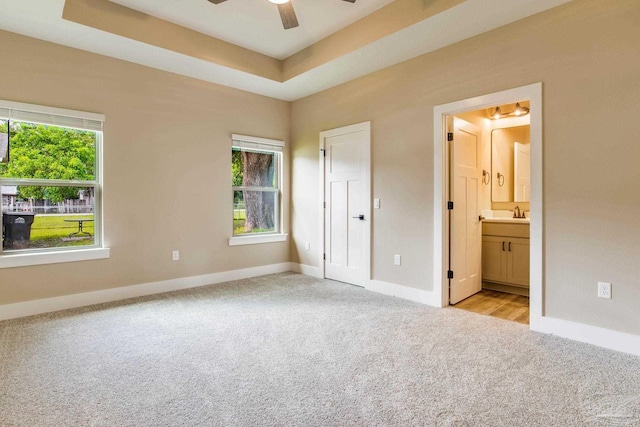 205 Webb St, Cantonment, FL 32533 - unfurnished bedroom with light carpet, multiple windows, baseboards, and ensuite bath
