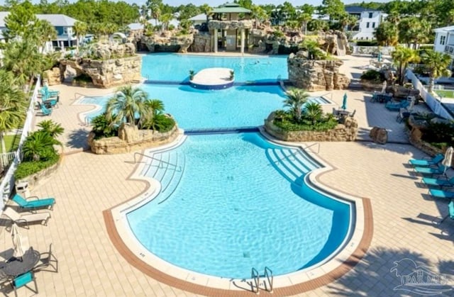 view of swimming pool with a patio area