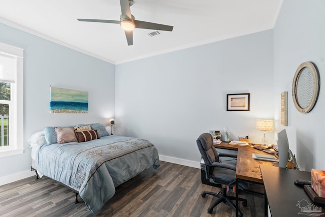 bedroom with crown molding, dark wood-type flooring, and ceiling fan