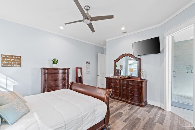 bedroom with light hardwood / wood-style floors, ornamental molding, ceiling fan, and ensuite bathroom