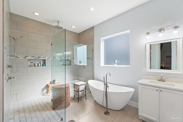 bathroom featuring vanity and separate shower and tub