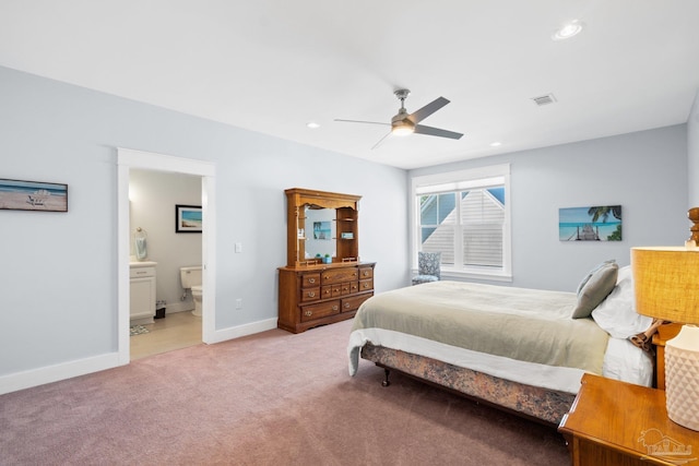 carpeted bedroom with connected bathroom and ceiling fan