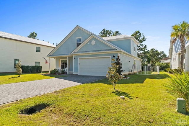 view of front facade featuring a front yard and a garage