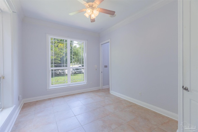 tiled empty room with crown molding and ceiling fan