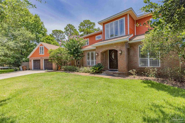 view of front of property featuring a garage and a front lawn