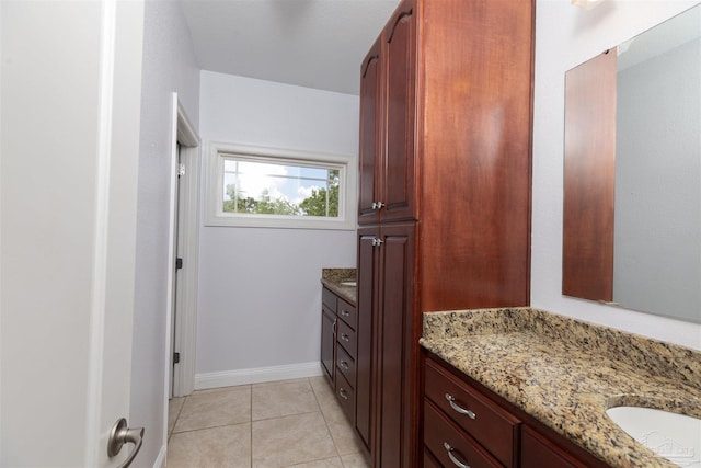 bathroom with tile patterned flooring and vanity