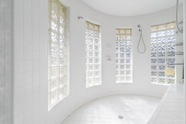 bathroom with tiled shower