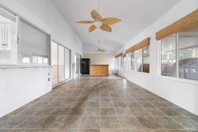 interior space featuring vaulted ceiling and ceiling fan