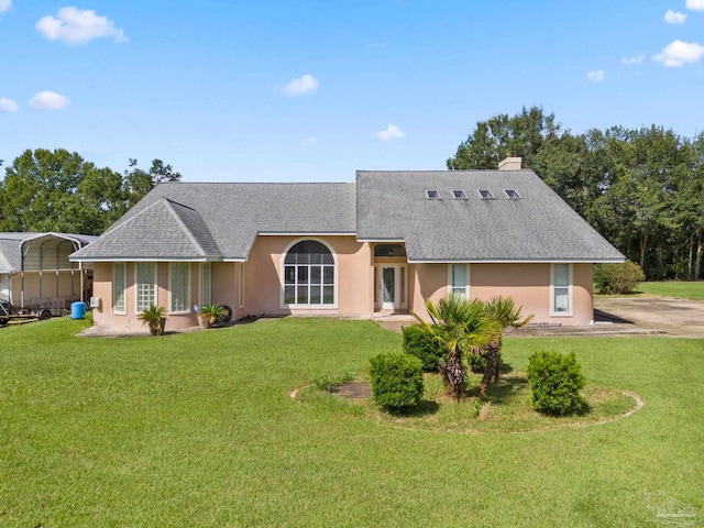 ranch-style home featuring a front yard