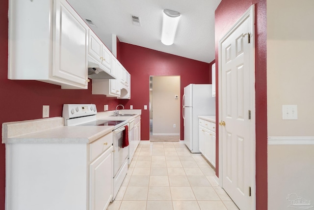 kitchen featuring white appliances, white cabinets, premium range hood, light tile patterned floors, and lofted ceiling