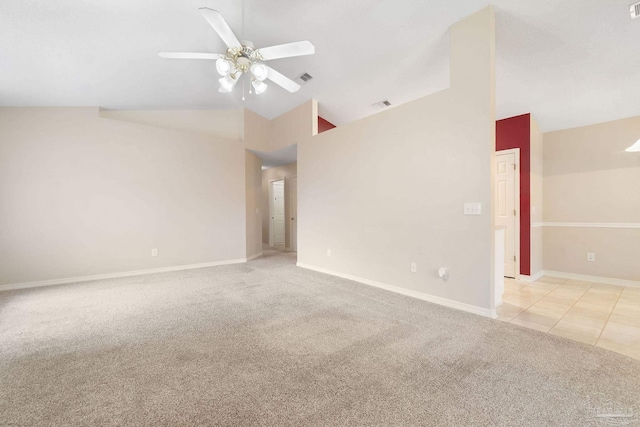 carpeted empty room with high vaulted ceiling and ceiling fan