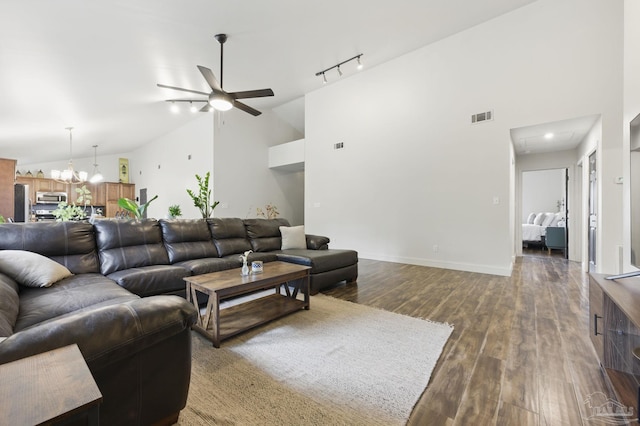 4793 Coronado Cir, Crestview, FL 32539 - living room featuring a ceiling fan, wood finished floors, a chandelier, rail lighting, and baseboards