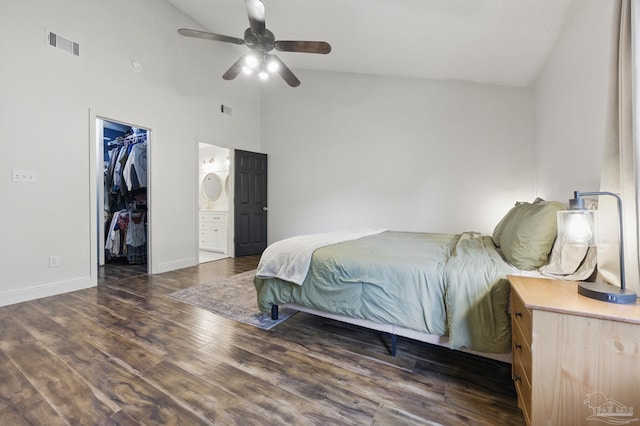 4793 Coronado Cir, Crestview, FL 32539 - bedroom with wood finished floors, a walk in closet, baseboards, high vaulted ceiling, and ensuite bath