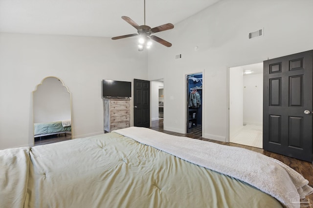 4793 Coronado Cir, Crestview, FL 32539 - bedroom featuring wood finished floors, a spacious closet, high vaulted ceiling, a closet, and baseboards