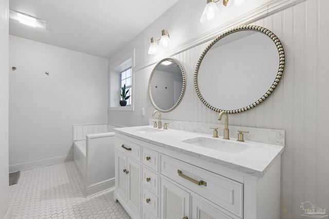 4793 Coronado Cir, Crestview, FL 32539 - full bathroom with a garden tub, double vanity, and baseboards
