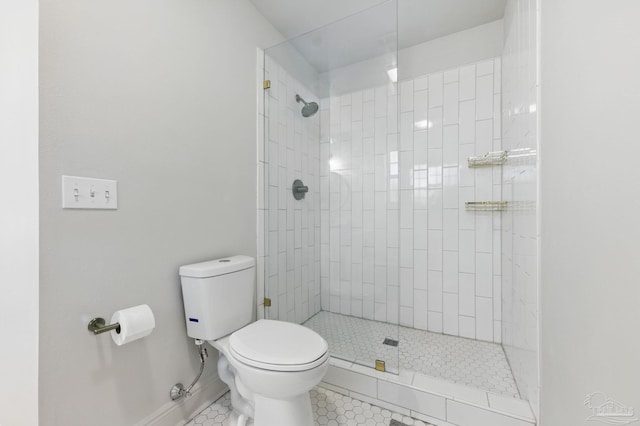 4793 Coronado Cir, Crestview, FL 32539 - full bathroom featuring toilet, tile patterned floors, a tile shower, and baseboards