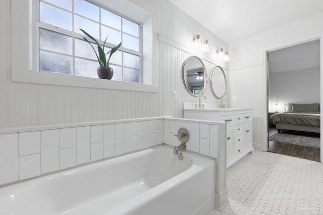 4793 Coronado Cir, Crestview, FL 32539 - ensuite bathroom featuring a bath, vanity, and tile patterned floors