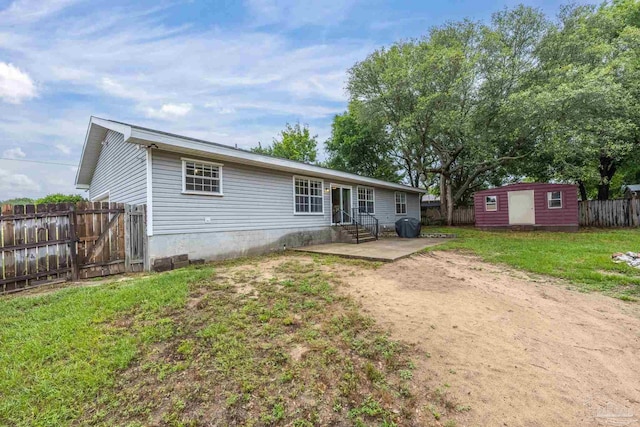 4793 Coronado Cir, Crestview, FL 32539 - back of property with entry steps, a patio, a shed, and an outdoor structure