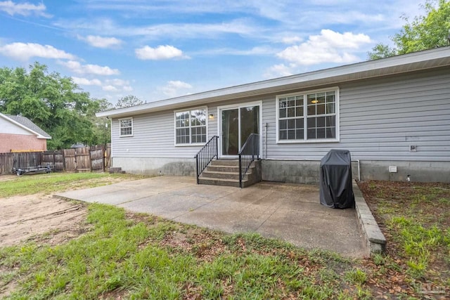 4793 Coronado Cir, Crestview, FL 32539 - rear view of property featuring entry steps, a patio, and fence