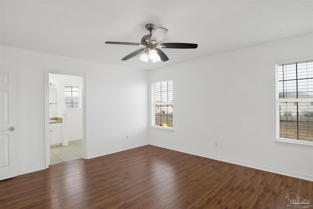 empty room with ceiling fan and light wood-type flooring