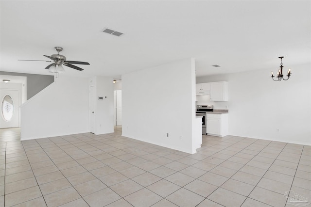 unfurnished living room featuring light tile patterned floors and ceiling fan with notable chandelier