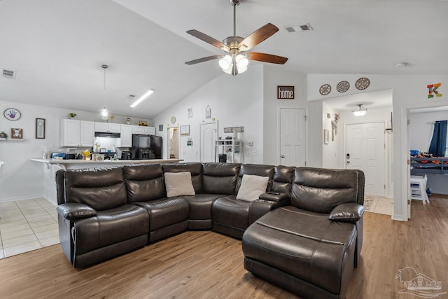 80 Woodland St, Cantonment, FL 32533 - living room with vaulted ceiling, a ceiling fan, and light wood-style flooring