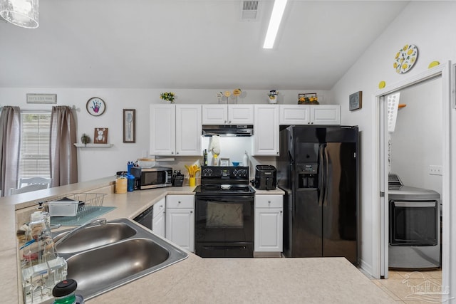 80 Woodland St, Cantonment, FL 32533 - kitchen with black appliances, washer / clothes dryer, under cabinet range hood, a sink, and white cabinetry