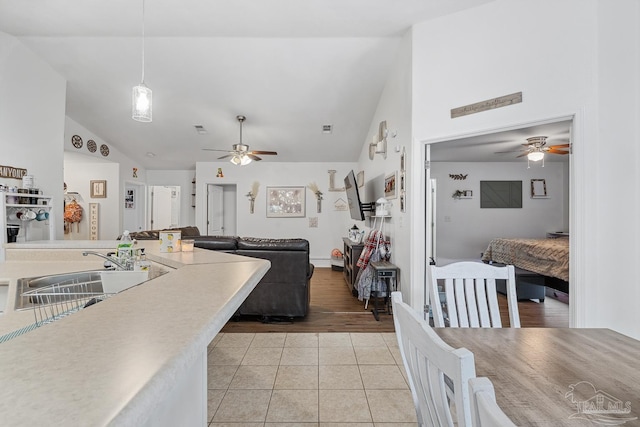 80 Woodland St, Cantonment, FL 32533 - dining space featuring a ceiling fan, high vaulted ceiling, and light tile patterned floors